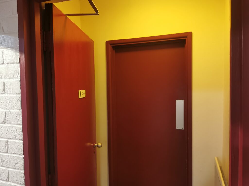 Doors to mens bathroom
