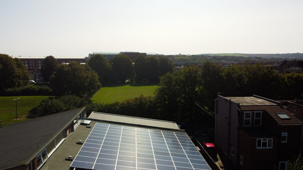Aerial shot of our building showing the solar panels on our roof
